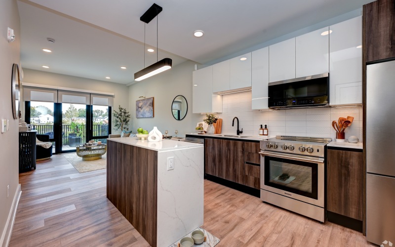 a kitchen with a bar stool and a table